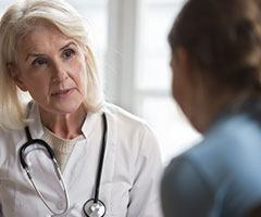 Physician speaking with patient