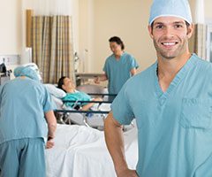 Nurses caring for patient, smiling
