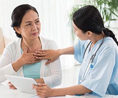 Woman experiencing chest pain