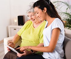 women looking at smart device