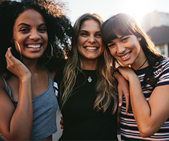 three young women laughing