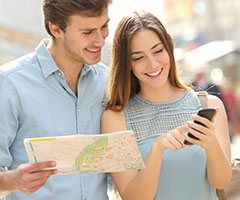 man and woman searching directions