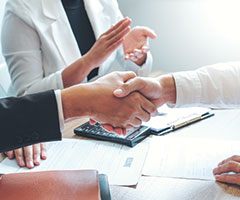 People shaking hands and clapping
