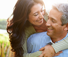 Woman hugging man