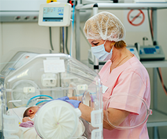 NICU Nurse with NICU patient