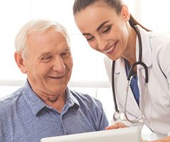 Physician with senior patient